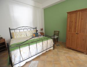 En eller flere senge i et værelse på Agriturismo Antichi Ulivi Collina