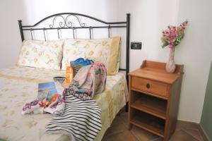 מיטה או מיטות בחדר ב-Agriturismo Antichi Ulivi Collina
