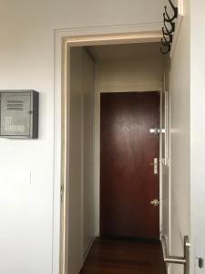 a door leading into a hallway with a door at Appartement T2 - Proche RER in Sartrouville