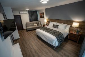 Säng eller sängar i ett rum på Hotel Corral Grande