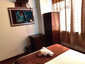 Letto o letti in una camera di La Merced Plaza Hospedaje