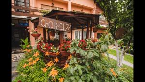 a flower shop with a sign on the front of a building at Prenociste Chardak in Tuzla