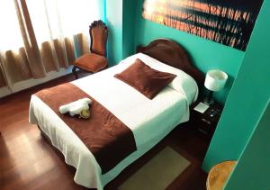 Letto o letti in una camera di La Merced Plaza Hospedaje