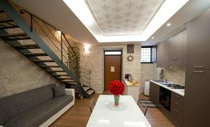 a living room with a couch and a table at Casa Aruci Sweet Home in Scicli