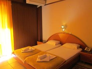 Postel nebo postele na pokoji v ubytování Hotel Lito