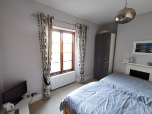 Postel nebo postele na pokoji v ubytování Thornham Cottage + 1 fotografie