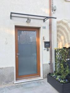 a door to a building with a glass door at MeM House - Tra il Lago di Garda e Verona in Castelnuovo del Garda
