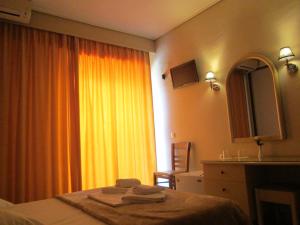 Postel nebo postele na pokoji v ubytování Hotel Lito