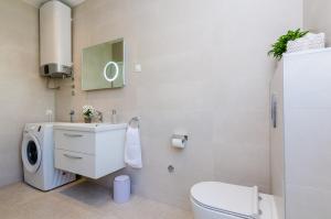 Kúpeľňa v ubytovaní New Art Apartment + 14 fotografií