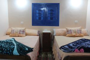 A bed or beds in a room at Tunis Village Chalet