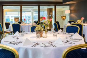 a table set up for a banquet in a restaurant at Glashaus Hotel in Tallaght