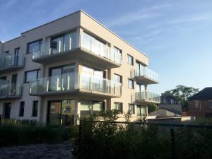 a building with balconies on the side of it at DUINLICHT-Oostduinkerke in Oostduinkerke