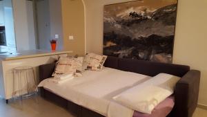 מיטה או מיטות בחדר ב-Mare E Monti Di Simonetta