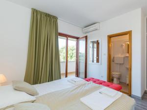 Postel nebo postele na pokoji v ubytování Ulika Rooms & Apartments