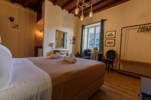 Katil atau katil-katil dalam bilik di Athina Guesthouse
