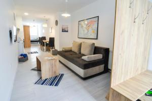 a living room with a couch and a table at Torus Apartments in Sarajevo