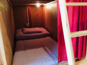 Voodi või voodid majutusasutuse Kitatono Guest House toas