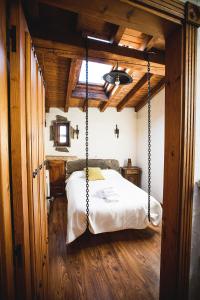 A bed or beds in a room at Orgullo Rural