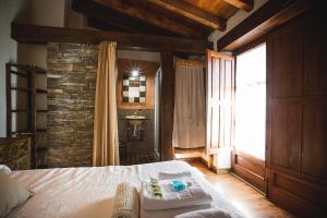 A bed or beds in a room at Orgullo Rural