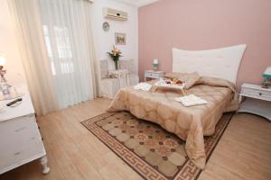 A bed or beds in a room at La Zagara B&B