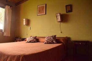 Postel nebo postele na pokoji v ubytování Terrazas Del Lago
