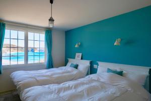 Ένα ή περισσότερα κρεβάτια σε δωμάτιο στο Aquaholic Iritahama