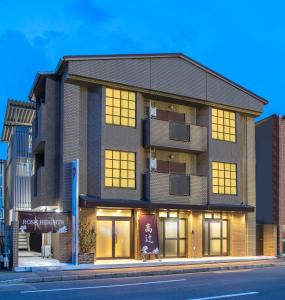 a building on the side of a street at Kyoto Takatsuji Rose Heights in Kyoto