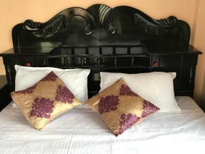Ένα ή περισσότερα κρεβάτια σε δωμάτιο στο Family Guesthouse Chitwan