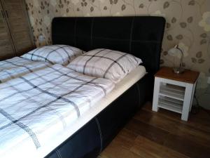 Postel nebo postele na pokoji v ubytování Apartmány Sharka -Šárka Justrová