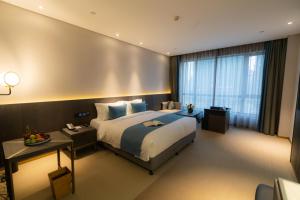 En eller flere senger på et rom på Hangzhou Cosy Park Hotel(Liangzhu)