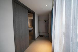En eller flere senger på et rom på Hangzhou Cosy Park Hotel(Liangzhu)
