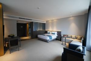 En eller flere senger på et rom på Hangzhou Cosy Park Hotel(Liangzhu)