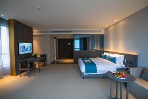 En eller flere senger på et rom på Hangzhou Cosy Park Hotel(Liangzhu)