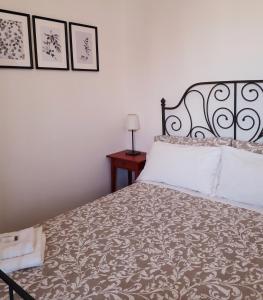 Postel nebo postele na pokoji v ubytování B&B MilleQuattrocento