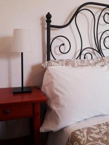 Postel nebo postele na pokoji v ubytování B&B MilleQuattrocento