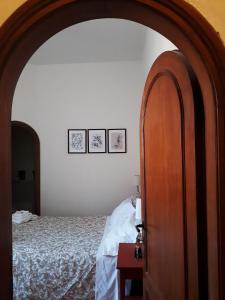 Postel nebo postele na pokoji v ubytování B&B MilleQuattrocento