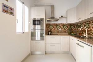 Kuchyňa alebo kuchynka v ubytovaní White Loft Alicante