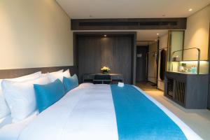 En eller flere senger på et rom på Hangzhou Cosy Park Hotel(Liangzhu)
