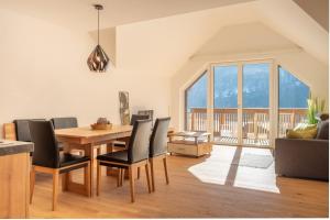 a dining room with a table and chairs at Landhaus Seereith in Faistenau