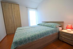 Postel nebo postele na pokoji v ubytování Apartments Vukas