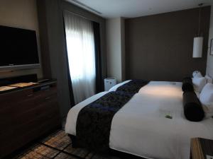 Letto o letti in una camera di Hotel Granvia Hiroshima