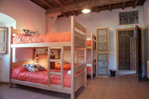 A bed or beds in a room at La Figal de Xugabolos, Salas