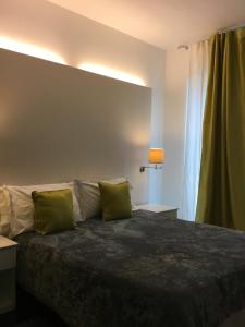 Postel nebo postele na pokoji v ubytování Taloshospitality