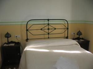 Łóżko lub łóżka w pokoju w obiekcie Casa Pousadoira