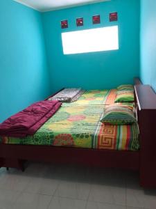 Tempat tidur dalam kamar di GIISCA FAMILY VILLA