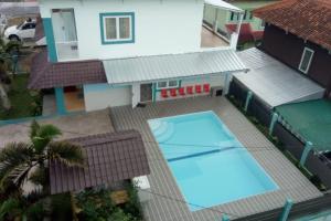 an overhead view of a house with a swimming pool at GIISCA FAMILY VILLA in Pacet
