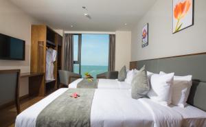 Un ou plusieurs lits dans un hébergement de l'établissement DTX Hotel Nha Trang