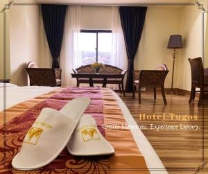 Postel nebo postele na pokoji v ubytování Hotel Tugos