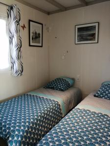 En eller flere senge i et værelse på les Bains de Mer