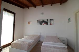 Voodi või voodid majutusasutuse Borgo Cenate toas